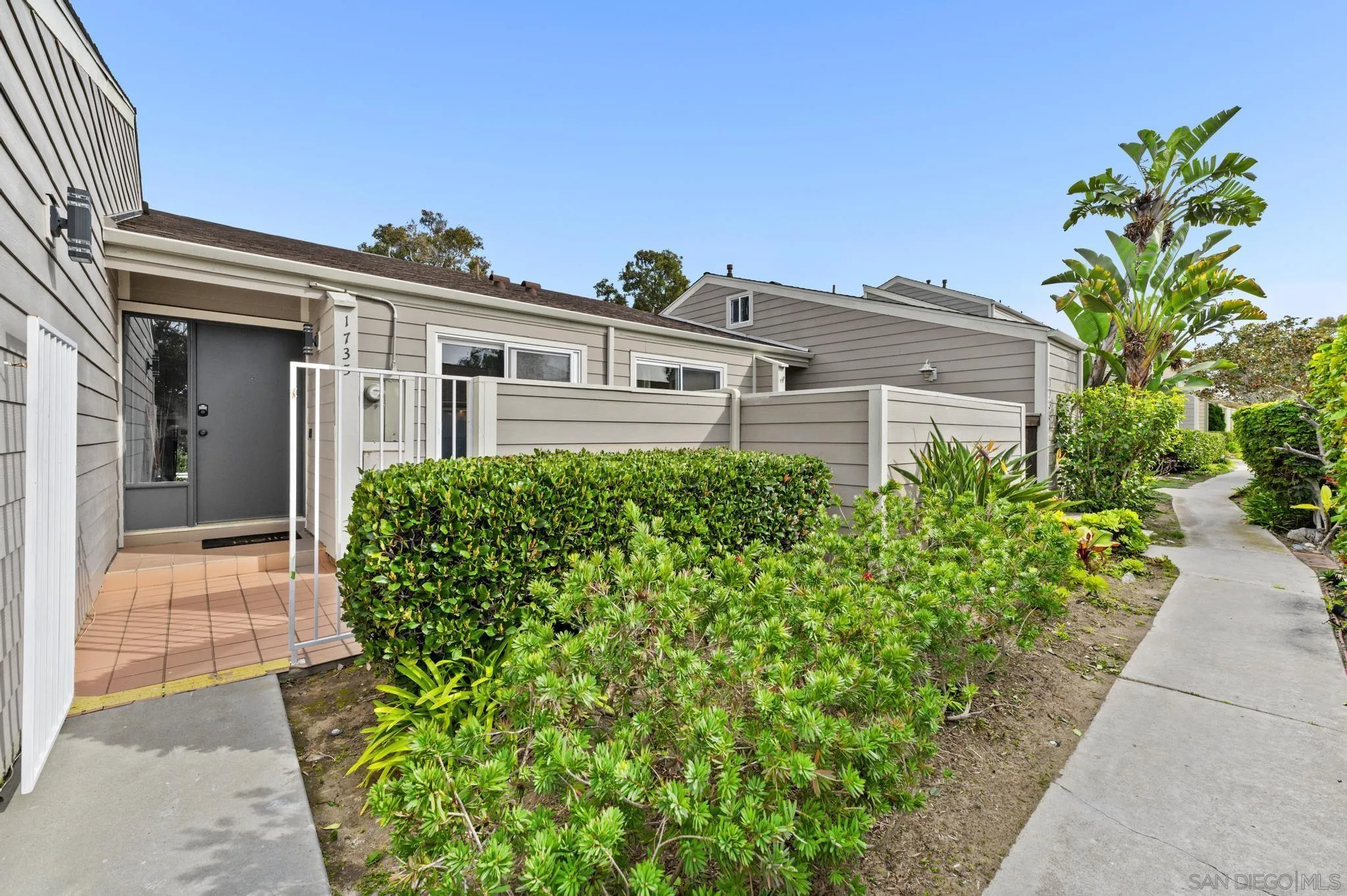 1735 Aldersgate Road Encinitas, CA 92024 - Photo 5 of 49 a front view of a house with a yard