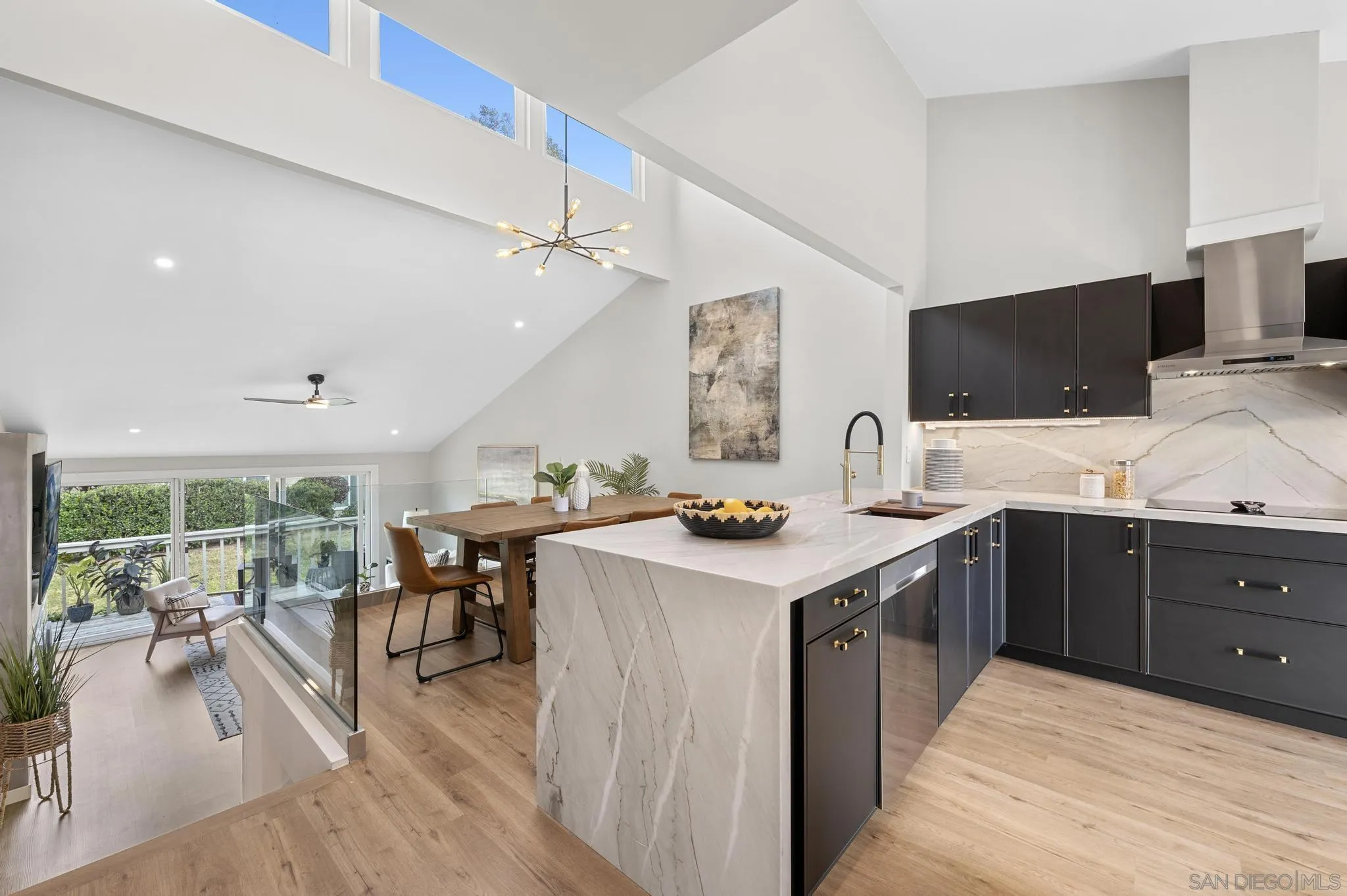 1735 Aldersgate Road Encinitas, CA 92024 - Photo 7 of 49 a kitchen with a sink stove and wooden floor