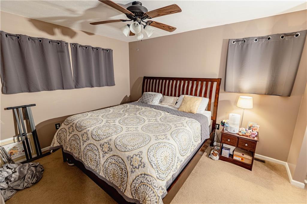 3673 Mitchell Road New Castle, PA 16105 - Photo 11 of 25 a bedroom with a bed and a mirror