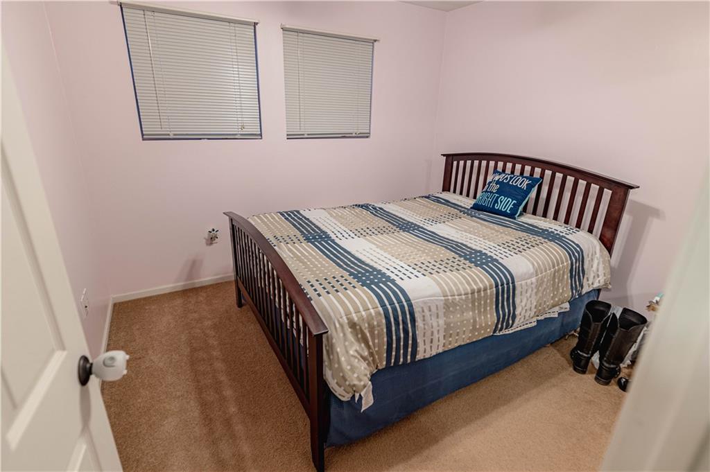 3673 Mitchell Road New Castle, PA 16105 - Photo 14 of 25 a bedroom with a bed and wooden floor