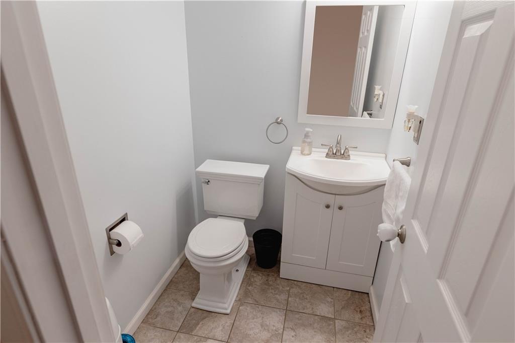 3673 Mitchell Road New Castle, PA 16105 - Photo 17 of 25 a bathroom with a toilet sink and mirror