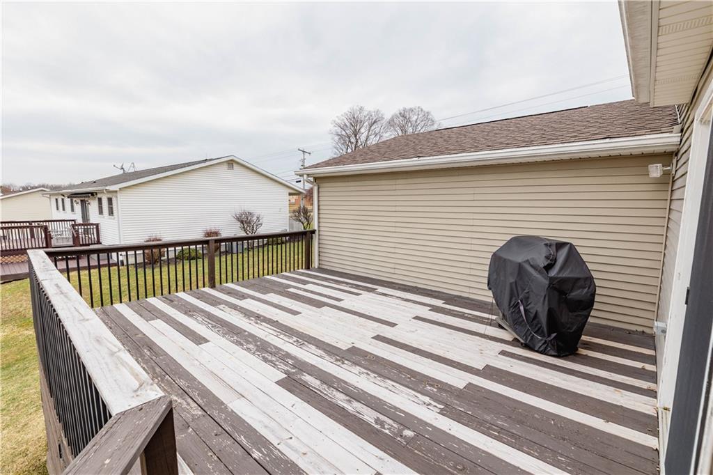 3673 Mitchell Road New Castle, PA 16105 - Photo 19 of 25 a view of a roof deck with wooden floor and fence