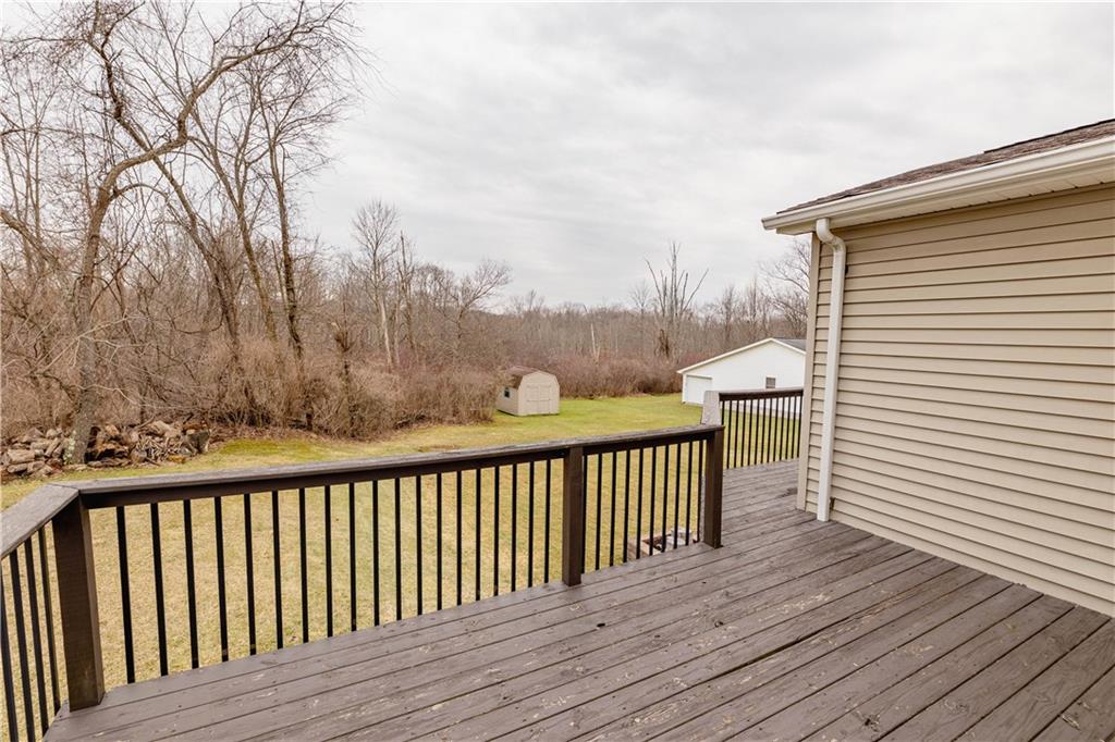 3673 Mitchell Road New Castle, PA 16105 - Photo 20 of 25 a balcony with wooden floor and fence