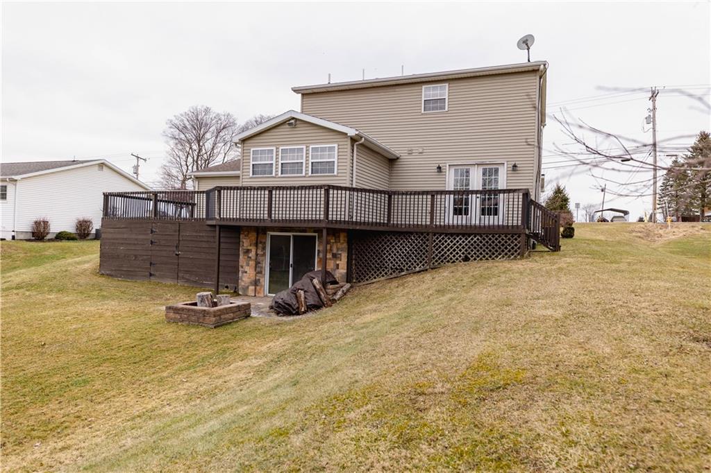 3673 Mitchell Road New Castle, PA 16105 - Photo 23 of 25 a view of a house with wooden roof and sitting area