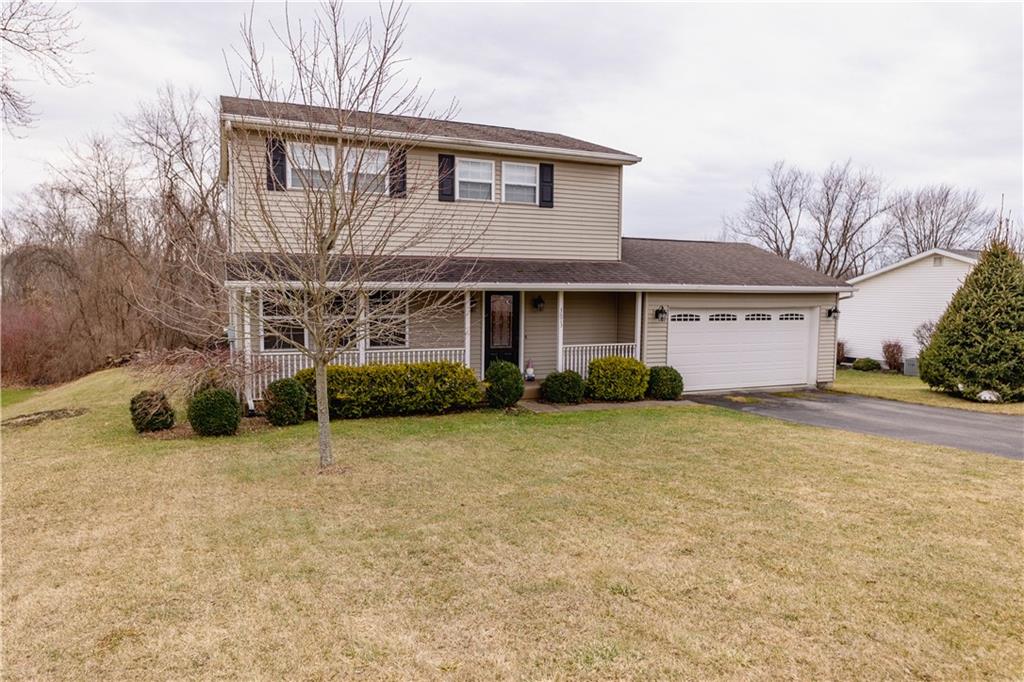 3673 Mitchell Road New Castle, PA 16105 - Photo 3 of 25 a front view of a house with a yard and garage