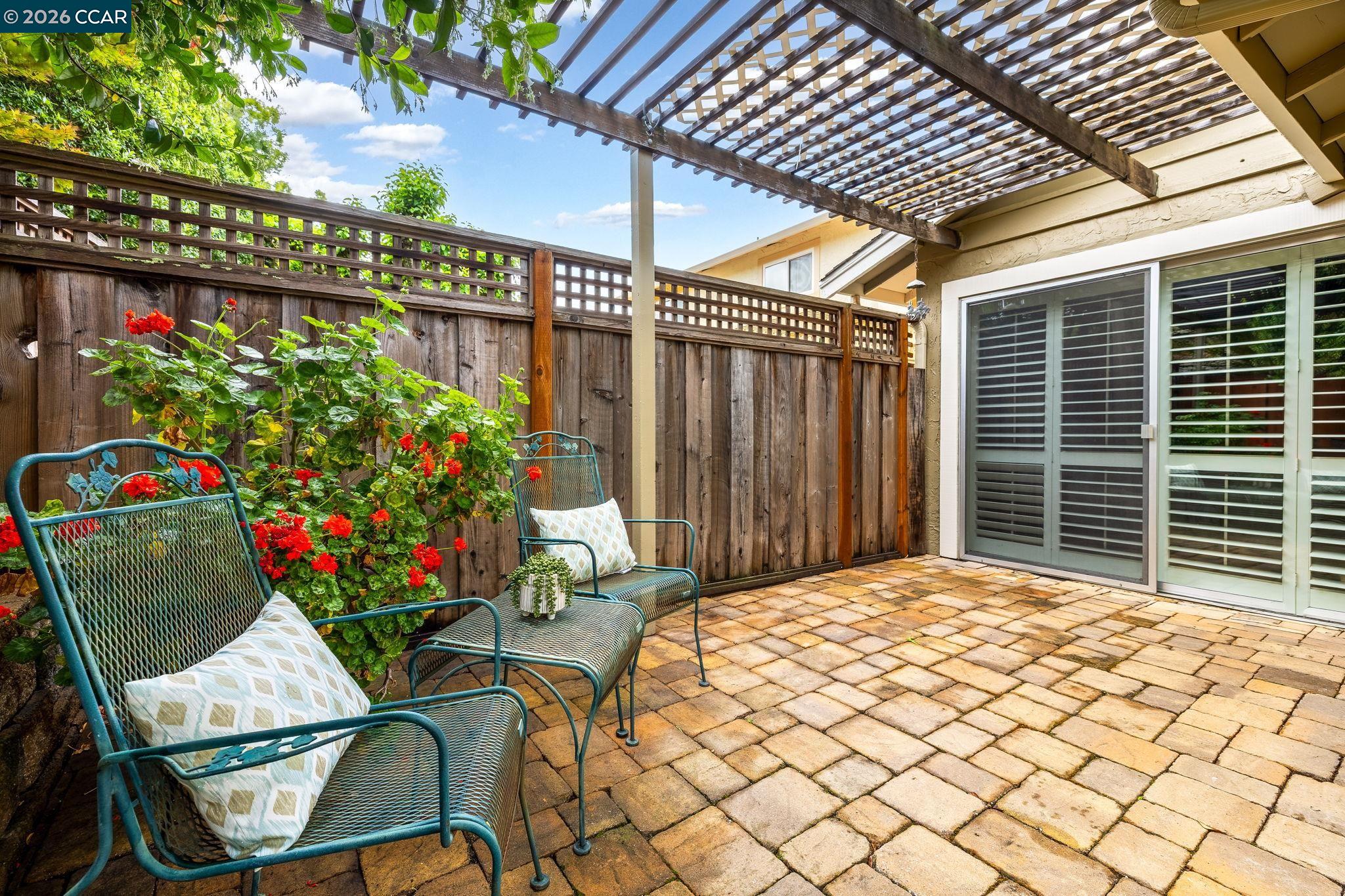 2095 Robb Road Walnut Creek, CA 94596 - Photo 17 of 26 a view of a porch with a table and chairs