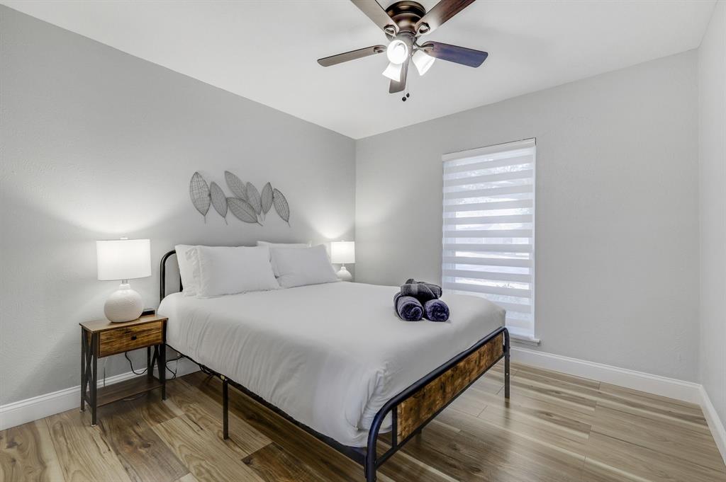 5112 Arbor Glen Road The Colony, TX 75056 - Photo 24 of 40 Bedroom with ceiling fan and wood-type flooring