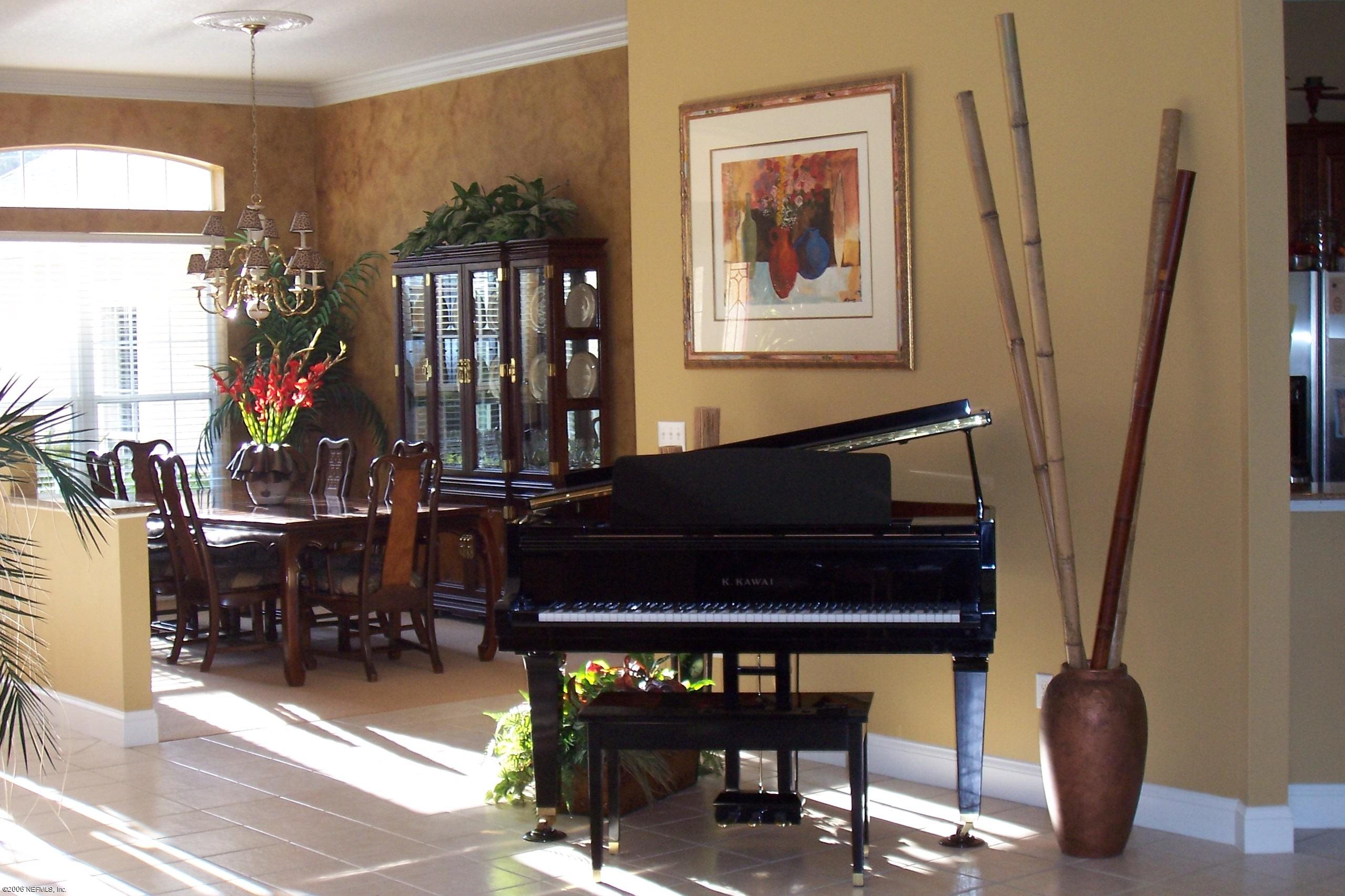 200 Clatter Bridge Road Ponte Vedra Beach, FL 32081 - Photo 3 of 12 a living room with furniture a piano and a flat screen tv