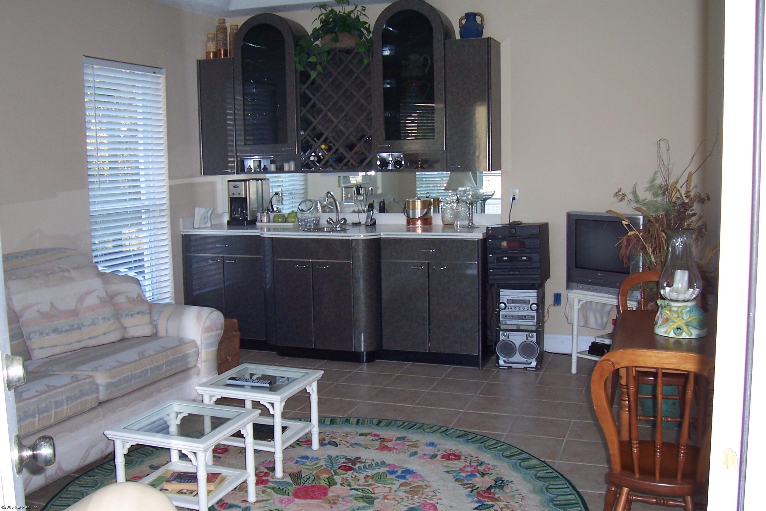 200 Clatter Bridge Road Ponte Vedra Beach, FL 32081 - Photo 7 of 12 a living room with furniture and wooden floor