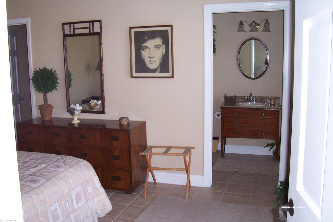 200 Clatter Bridge Road Ponte Vedra Beach, FL 32081 - Photo 8 of 12 a bedroom with a bed and a dresser