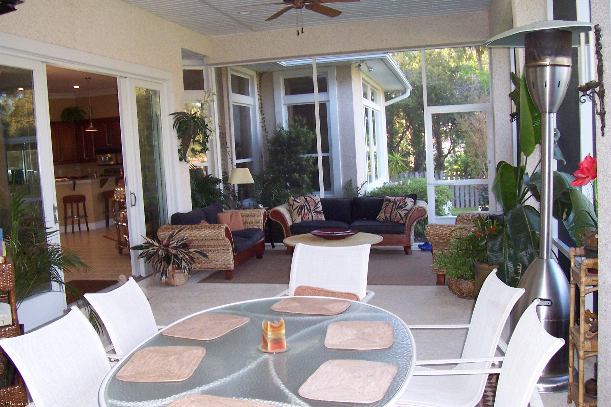 200 Clatter Bridge Road Ponte Vedra Beach, FL 32081 - Photo 9 of 12 a living room with furniture dining table and a large window