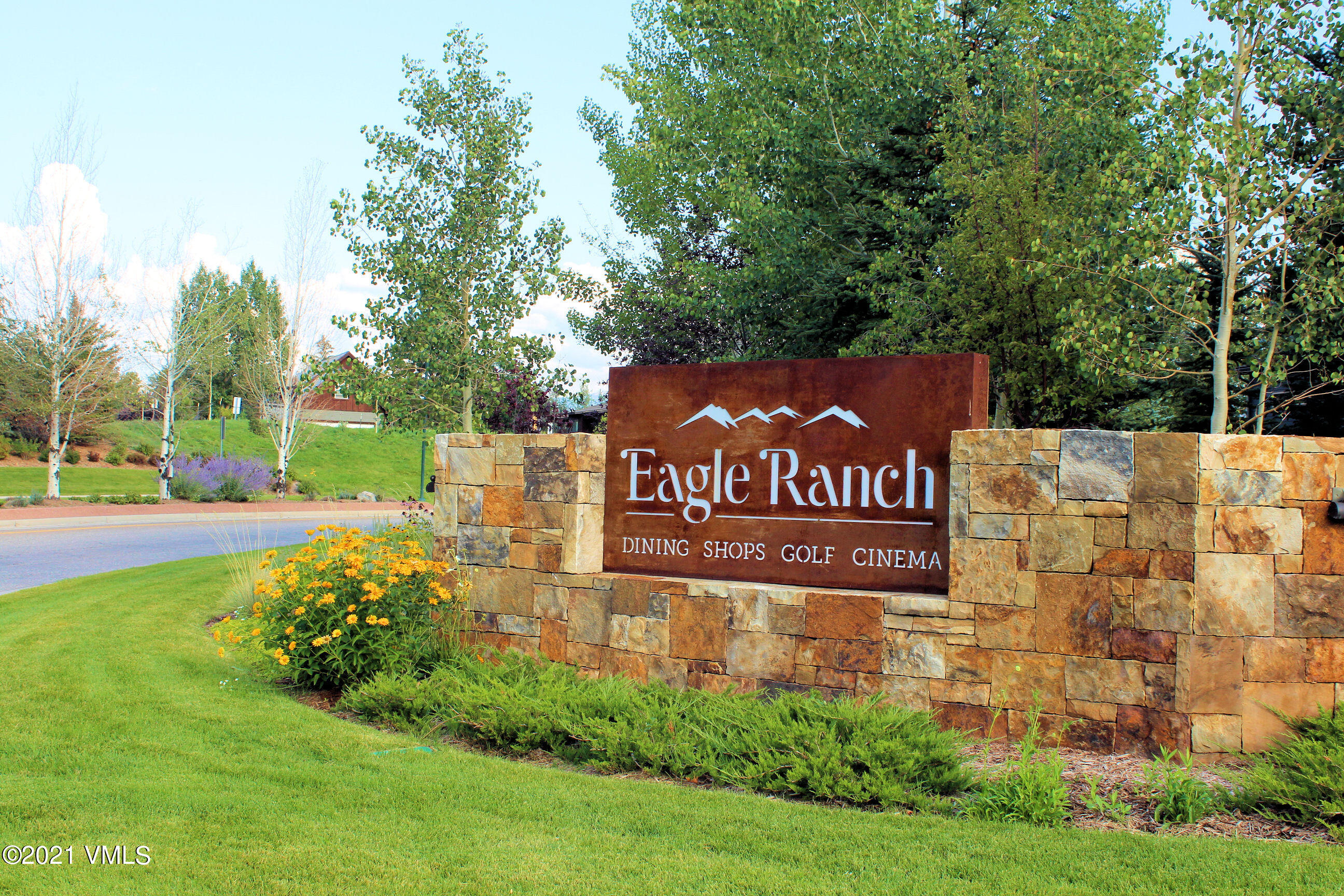 a view of outdoor space with sign board and garden