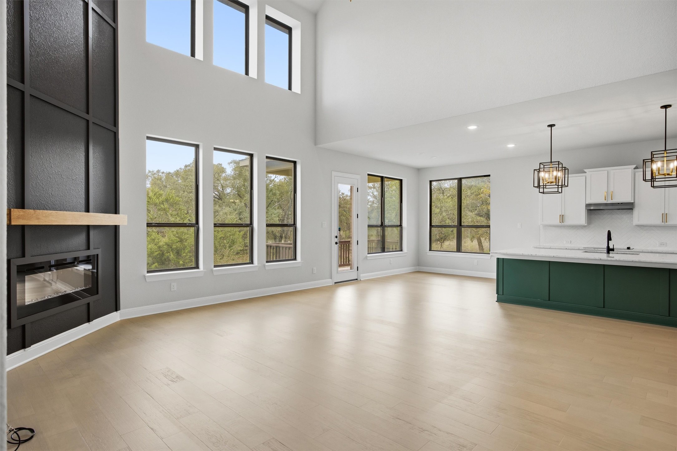 208 Tovas Secret Cove Georgetown, TX 78628 - Photo 11 of 40 a view of an empty room with a fireplace and a window