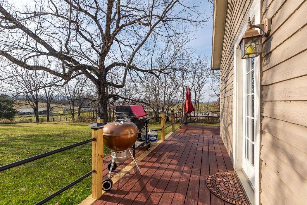 1594 Tinkling Spring Road Staunton, VA 24401 - Photo 14 of 69 a view of a porch with furniture and a yard