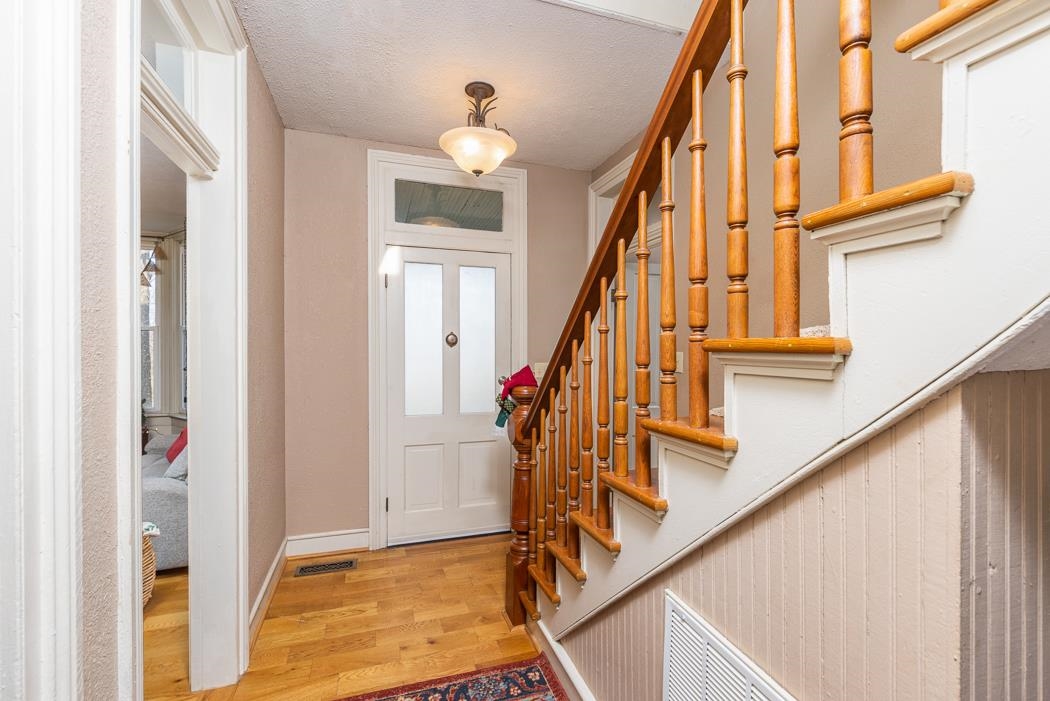 1594 Tinkling Spring Road Staunton, VA 24401 - Photo 21 of 69 a view of an entryway with wooden floor and stairs