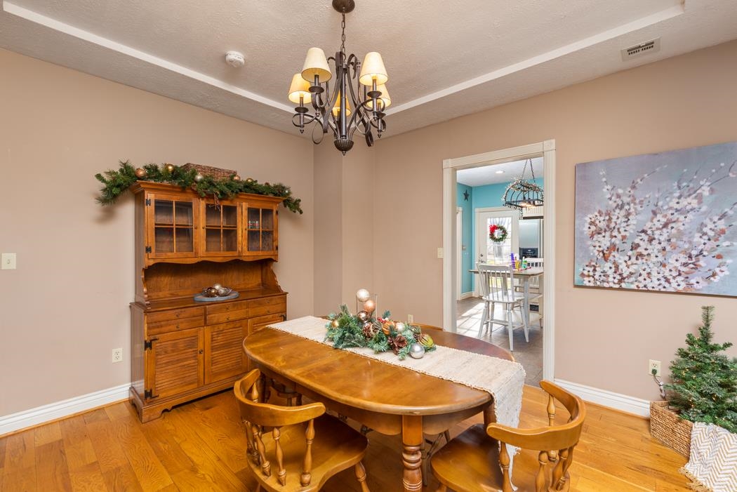 1594 Tinkling Spring Road Staunton, VA 24401 - Photo 25 of 69 a view of a dining room with furniture and chandelier