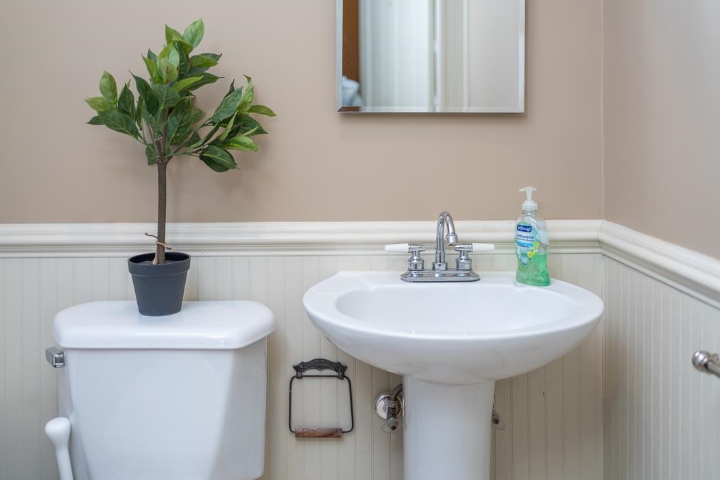 1594 Tinkling Spring Road Staunton, VA 24401 - Photo 48 of 69 a bathroom with a sink a toilet and a mirror