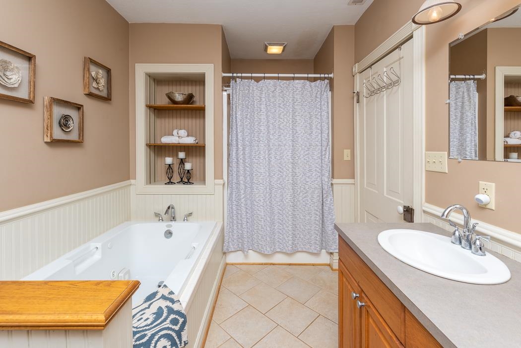1594 Tinkling Spring Road Staunton, VA 24401 - Photo 53 of 69 a bathroom with a tub a sink and a shower