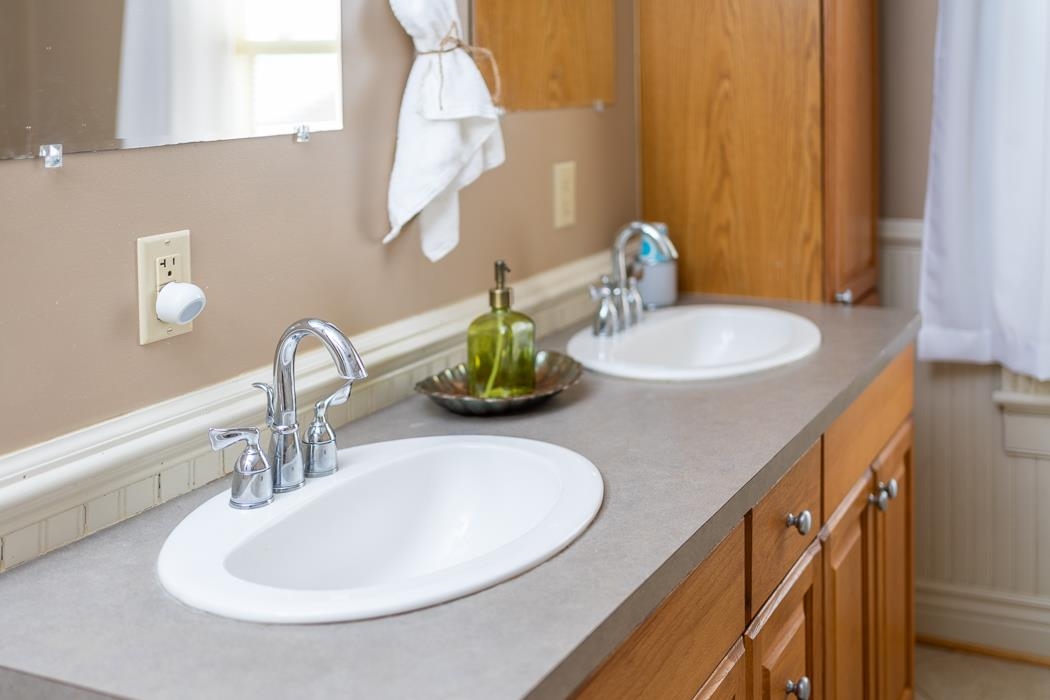 1594 Tinkling Spring Road Staunton, VA 24401 - Photo 54 of 69 a bathroom with a double vanity sink and a mirror