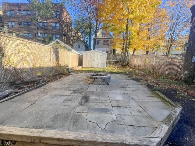 a view of a backyard of the house