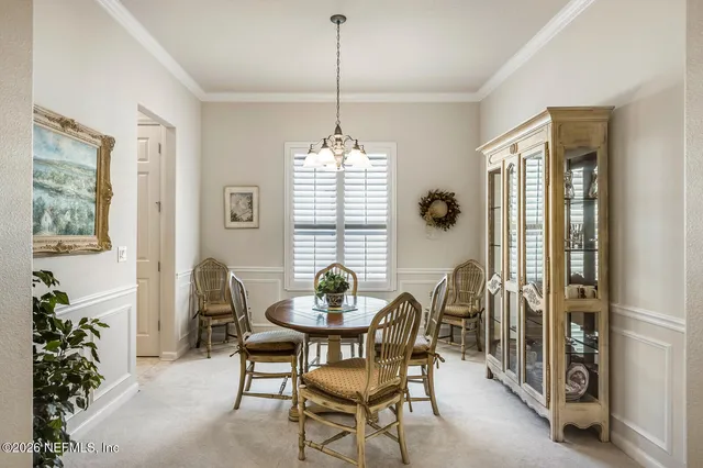 a kitchen with stainless steel appliances granite countertop a refrigerator a stove and a sink