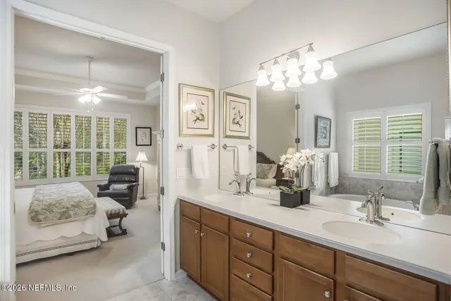 a spacious bedroom with a bed and a couch