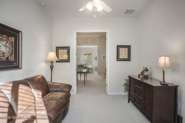 a bathroom with a sink vanity mirror and toilet