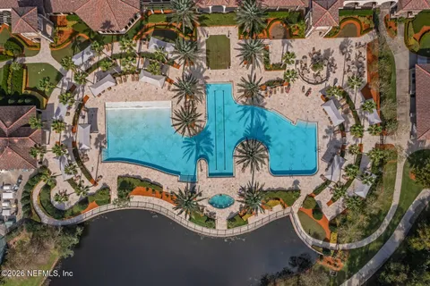 a view of a patio with couches a table and chairs with wooden floor