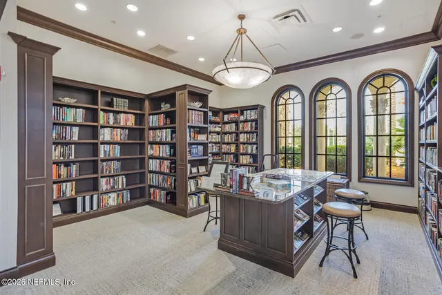 an aerial view of a house with garden space and trees