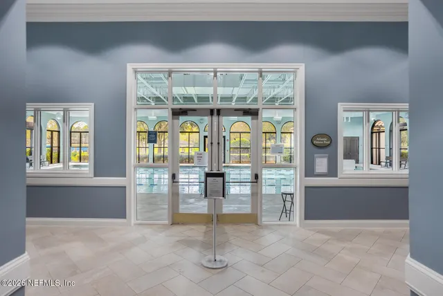 a view of swimming pool with outdoor seating and a potted plant