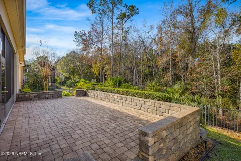 a view of a pathway with a wrought fence