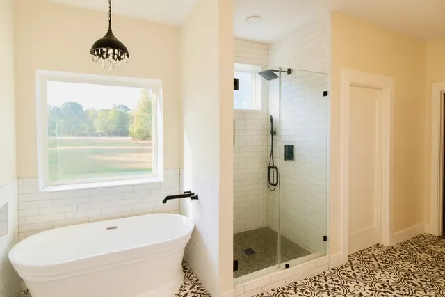a bathroom with a glass door shower