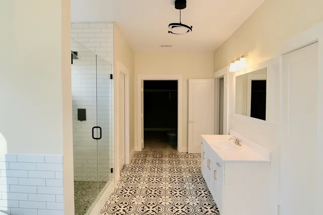 a large kitchen with a table and chairs