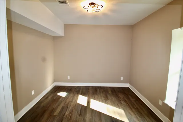 a view of a bathroom from the hallway
