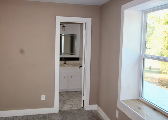 a view of a field with some trees