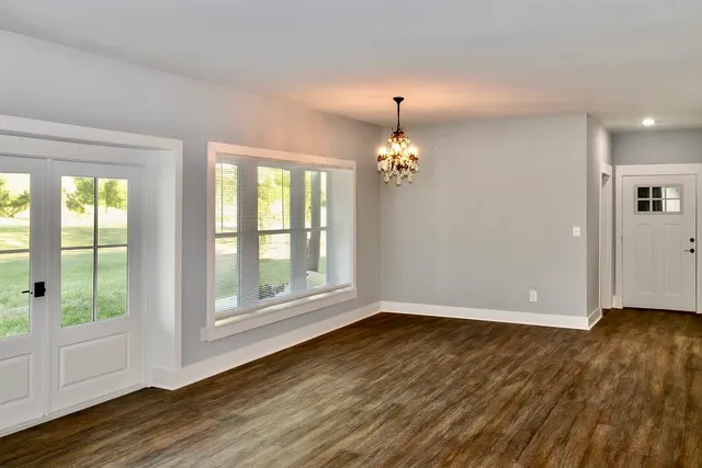 a view of entryway with wooden floor