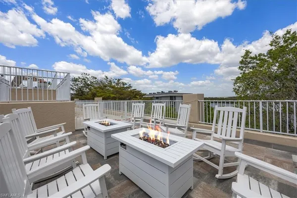 a view of a terrace with furniture and a terrace view