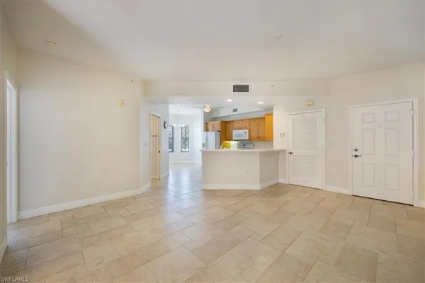 a view of a kitchen with a sink cabinets and a window