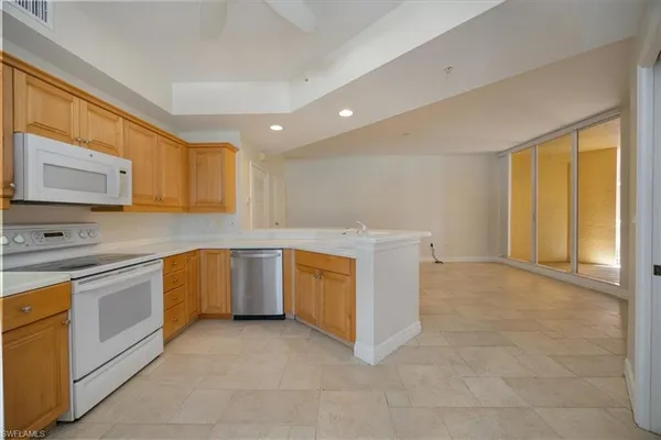 a kitchen with a stove a sink and a refrigerator