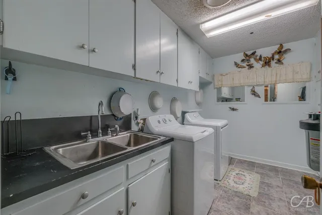 a kitchen with a sink and cabinets