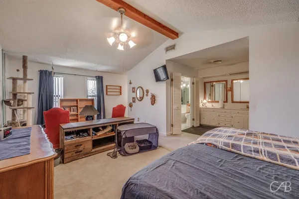 a bed room with furniture and a chandelier
