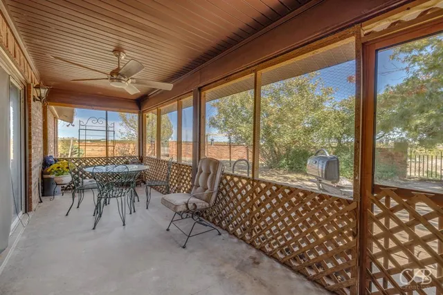 a dining room with furniture water view and a large window