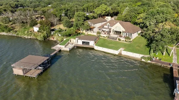 an aerial view of a house with a lake view