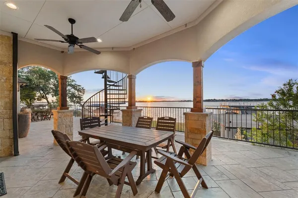 a view of an outside dining space with furniture