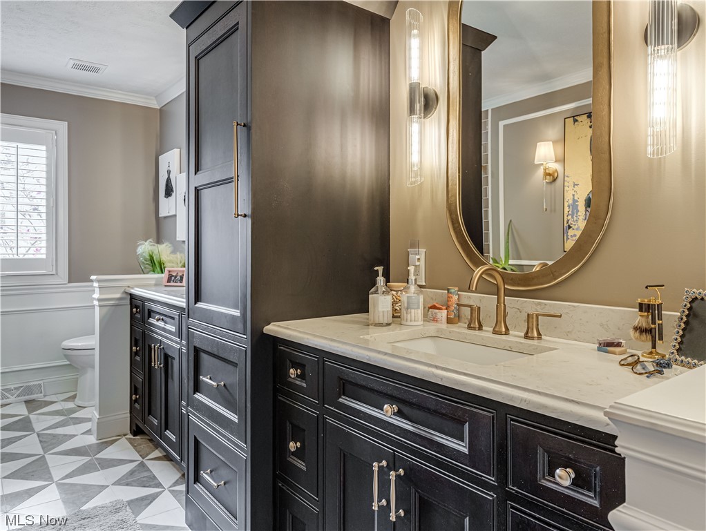 3498 Bancroft Road Akron, OH 44333 - Photo 21 of 30 Bathroom with ornamental molding, vanity, tile floors, and toilet