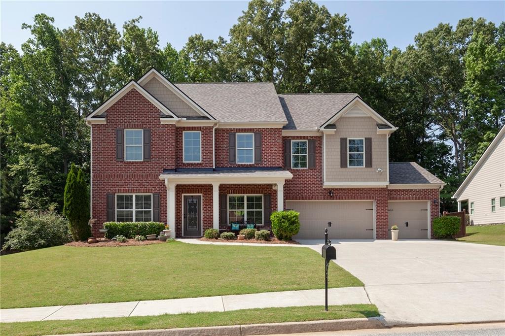 211 Parc Drive Canton, GA 30114 - Photo 1 of 1 a front view of a house with a yard
