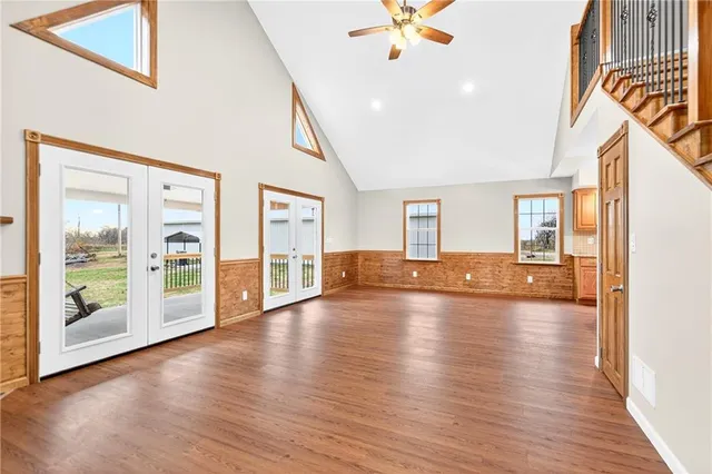 a view of an entryway with wooden floor