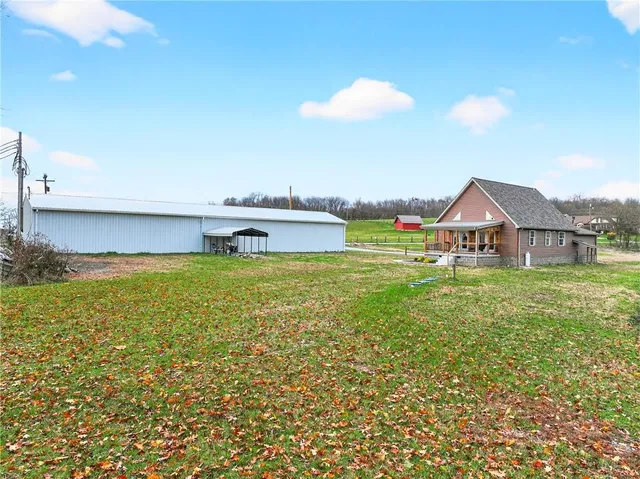 a view of a house with a big yard