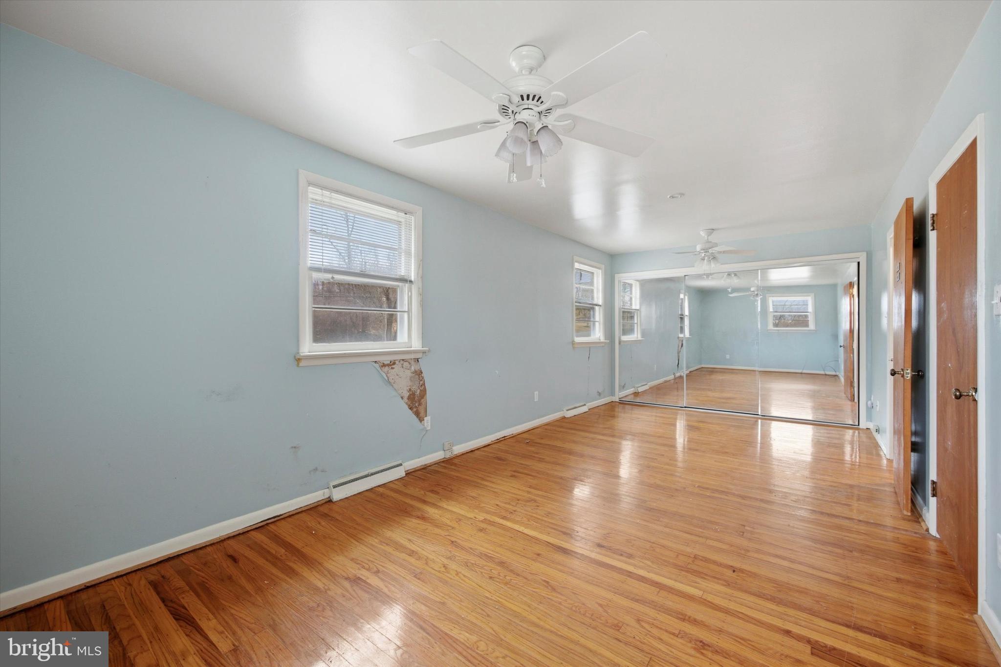 129 Locksley Road Glen Mills, PA 19342 - Photo 15 of 36 wooden floor in an empty room with a window