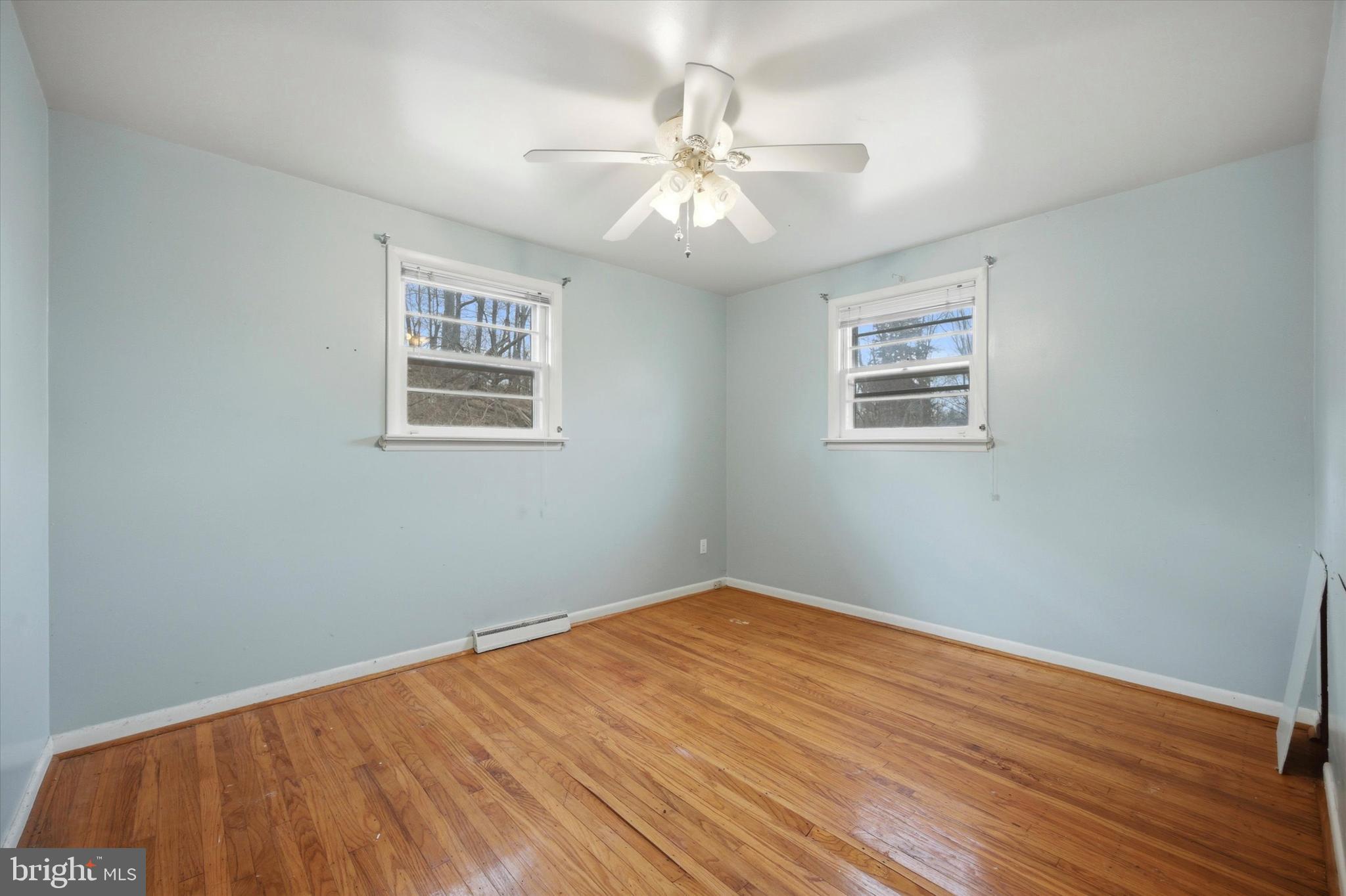 129 Locksley Road Glen Mills, PA 19342 - Photo 17 of 36 a view of an empty room with wooden floor